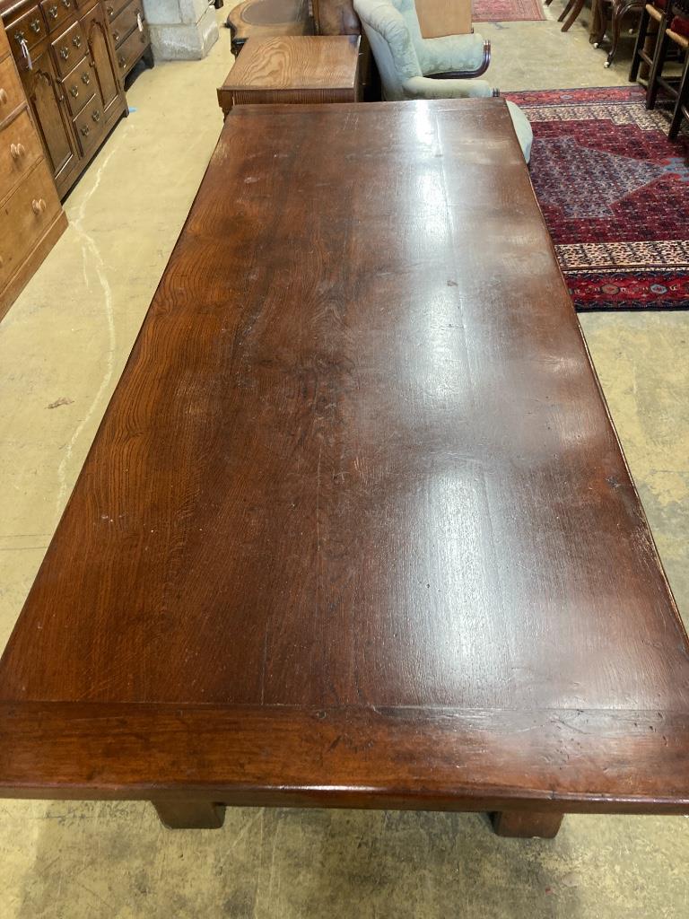 An 18th century style oak refectory dining table, length 228cm, depth 91cm, height 76cm